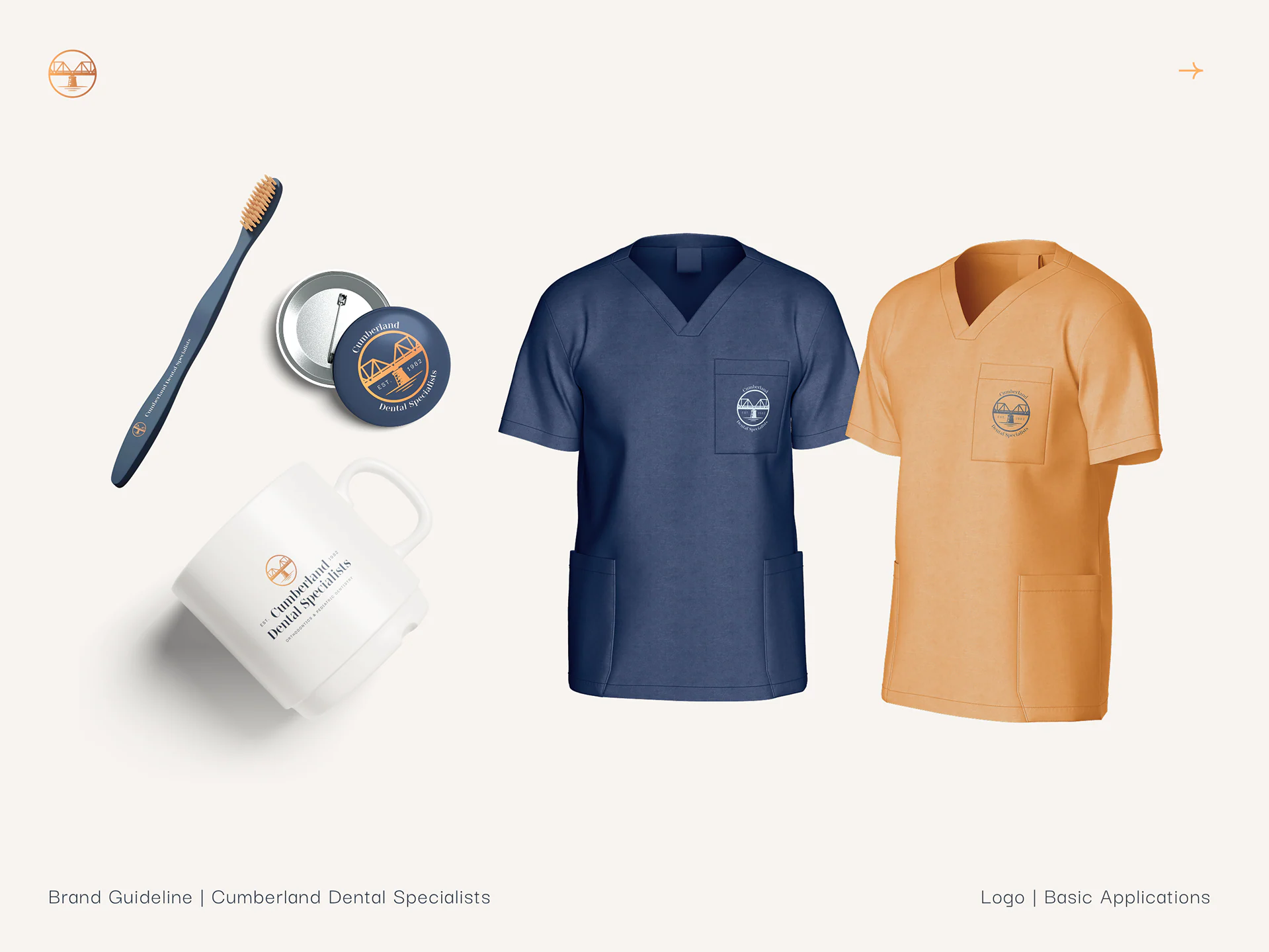 Navy and copper scrubs, a mug, a toothbrush and a badge with the seal.